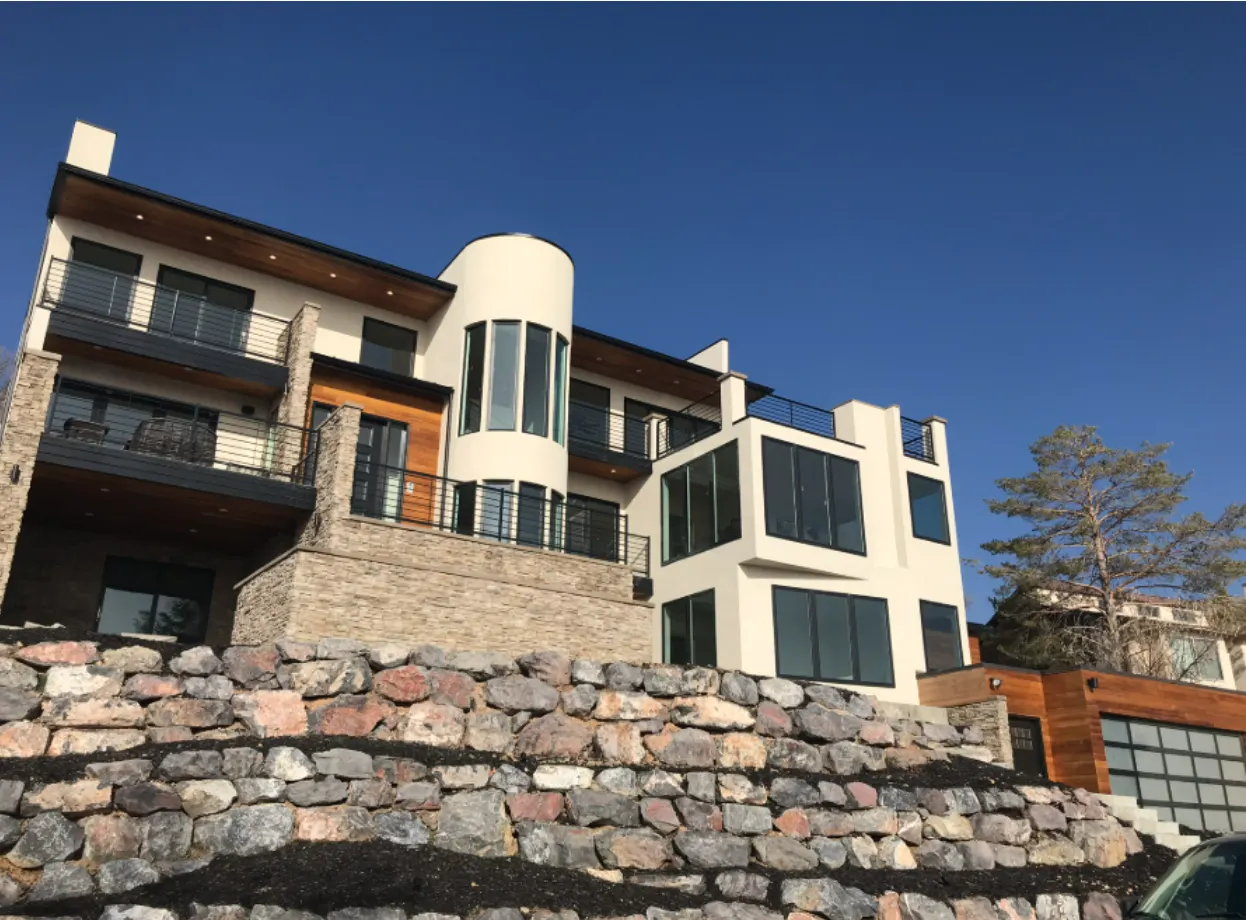 Luxury hillside home with stone retaining walls — Utah real estate project